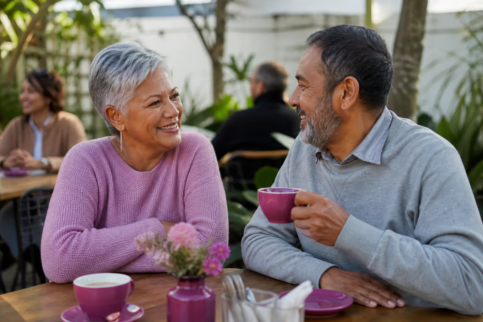 Two people over 50 talking over coffee in Central Scotland